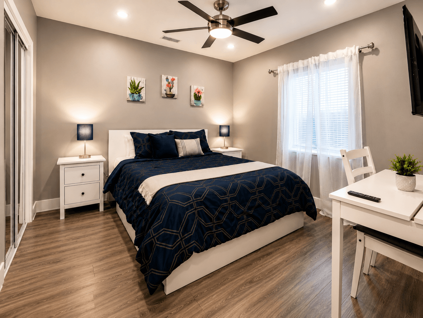 Second bedroom with queen bed and reading chair