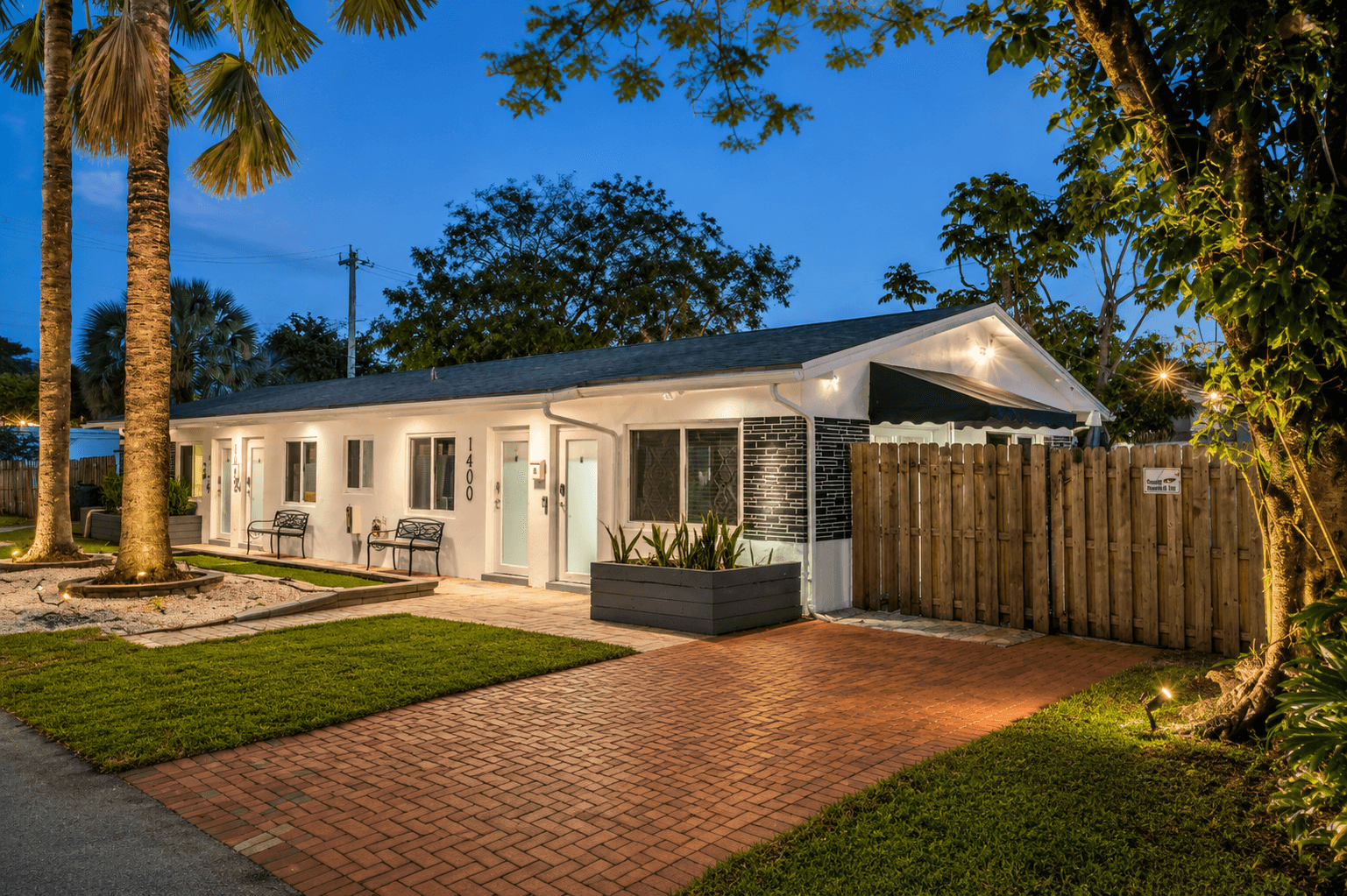 Poinsettia Paradise side elevation with private entrance and tropical landscaping